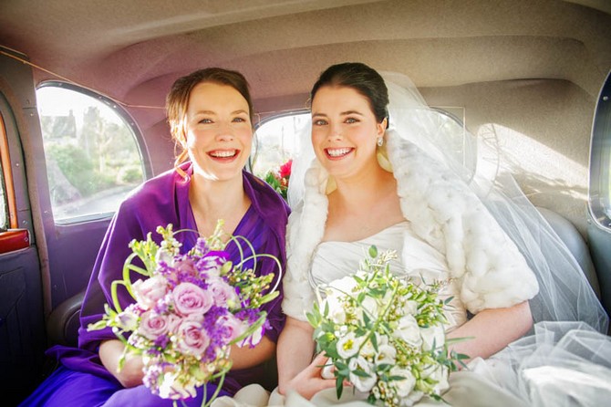 bridesmaid and bride in car